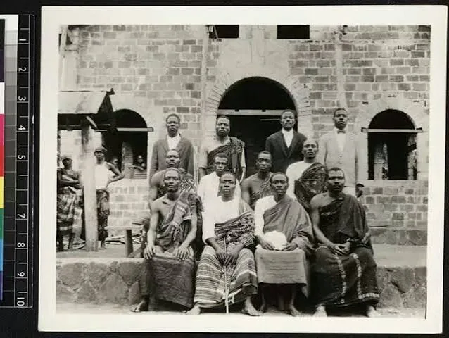 A group portrait outside an early Lagos photography studio